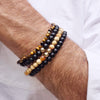 Men's Tiger's Eye bracelets stacked with 2 Black Onyx bracelets