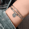 Pancake Silver & Leather Adjustable Size Bracelet shown with the Silver Puffed Heart Charm