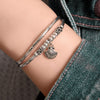 Pancake Silver & Leather Adjustable Size Bracelet shown with the silver Shell charm