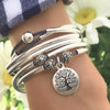 April 2 strand wrap bracelet in natural true blue leather, comes as shown with Tree of Life charm attached.