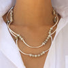 Bella wrap bracelet shown as a necklace in metallic berry leather