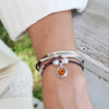 Citrine Yellow Crystal Charm shown on the Mini Friendship Wrap Add Your Charm Choice in Natural Purple Leather (sold separately)