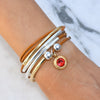Garnet Red Crystal Charm in Gold shown on the Girlfriend Wrap in Gold and Silver (sold separately)