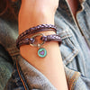 enamel blue heart charm as shown on the Mini Paisley in metallic berry leather, sold separately