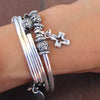 Open Cross Charm on the Mini June 2 Strand wrap bracelet in Natural Black Leather