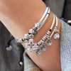 Faith bracelet stacked next to the Voyage bracelet, sold separately