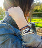 lizzy disc 3 strand wrap bracelet shown in gloss purple leather